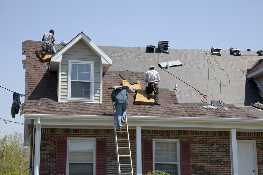Installing roof by our roofers